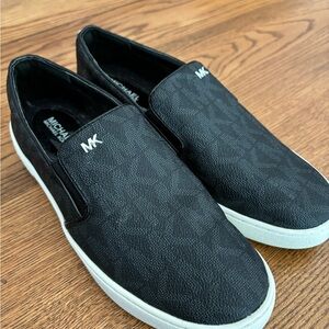 Michael Kors black slip on sneakers